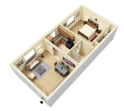 a bedroom with a bed and a desk in a room